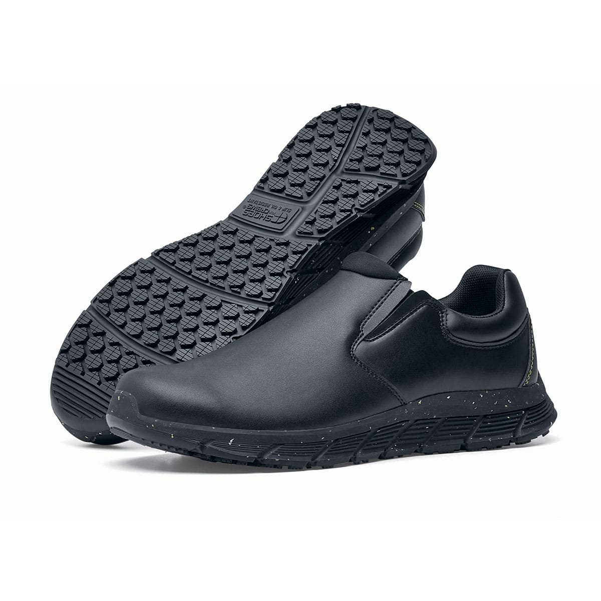 The Shoes for Crews Cater Eco Women's Black is a sustainable, slip-resistant safety shoe, pair seen from the left side and sole.