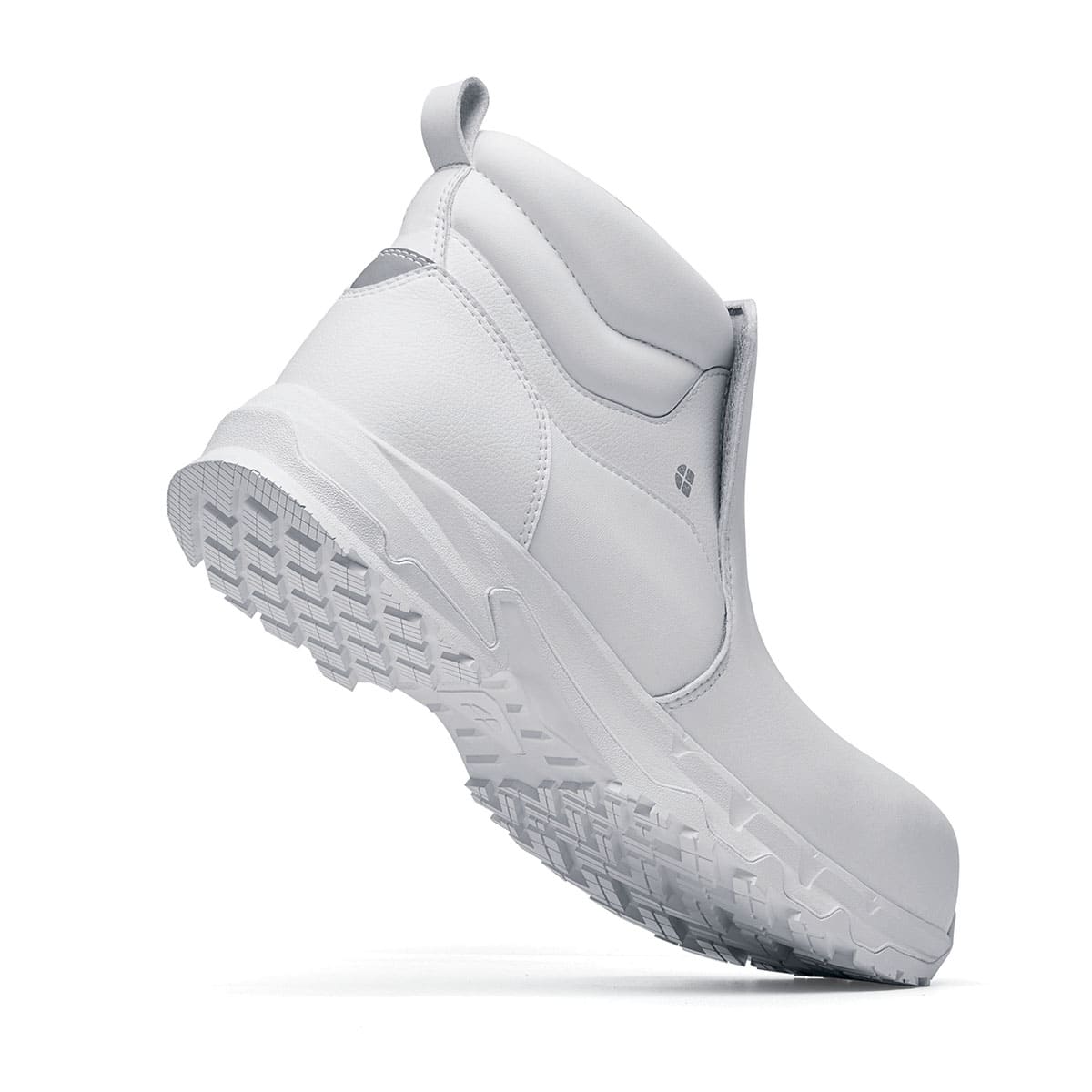 The Inny from Shoes For Crews is a safety shoe with a slip-resistant, clog-resistant upper sole and our advanced TripGuard technology, seen from the perpendicular.