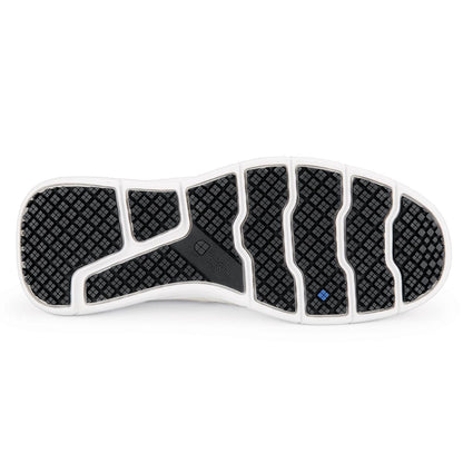 The Karina Black by Lila from Shoes For Crews are black slip-resistant trainers that are lightweight and have Flex Tread technology, seen from below.