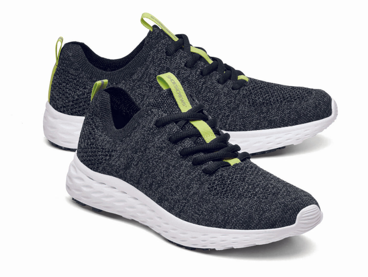 The Everlight™ ECO Womens Black/Grey from Shoes For Crews are lightweight, breathable slip-resistant trainers made from recycled materials,  pair seen from the right side, emphasised on the tip of the right  shoe.