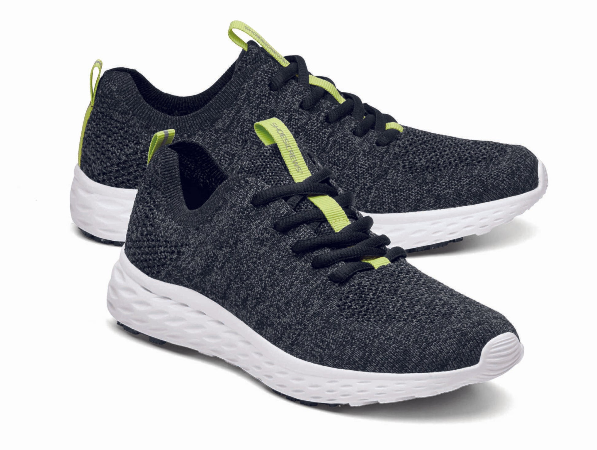 The Everlight™ ECO Womens Black/Grey from Shoes For Crews are lightweight, breathable slip-resistant trainers made from recycled materials,  pair seen from the right side, emphasised on the tip of the right  shoe.