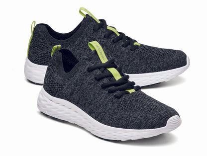 The Everlight™ ECO Womens Black/Grey from Shoes For Crews are lightweight, breathable slip-resistant trainers made from recycled materials,  pair seen from the right side, emphasised on the tip of the right  shoe.