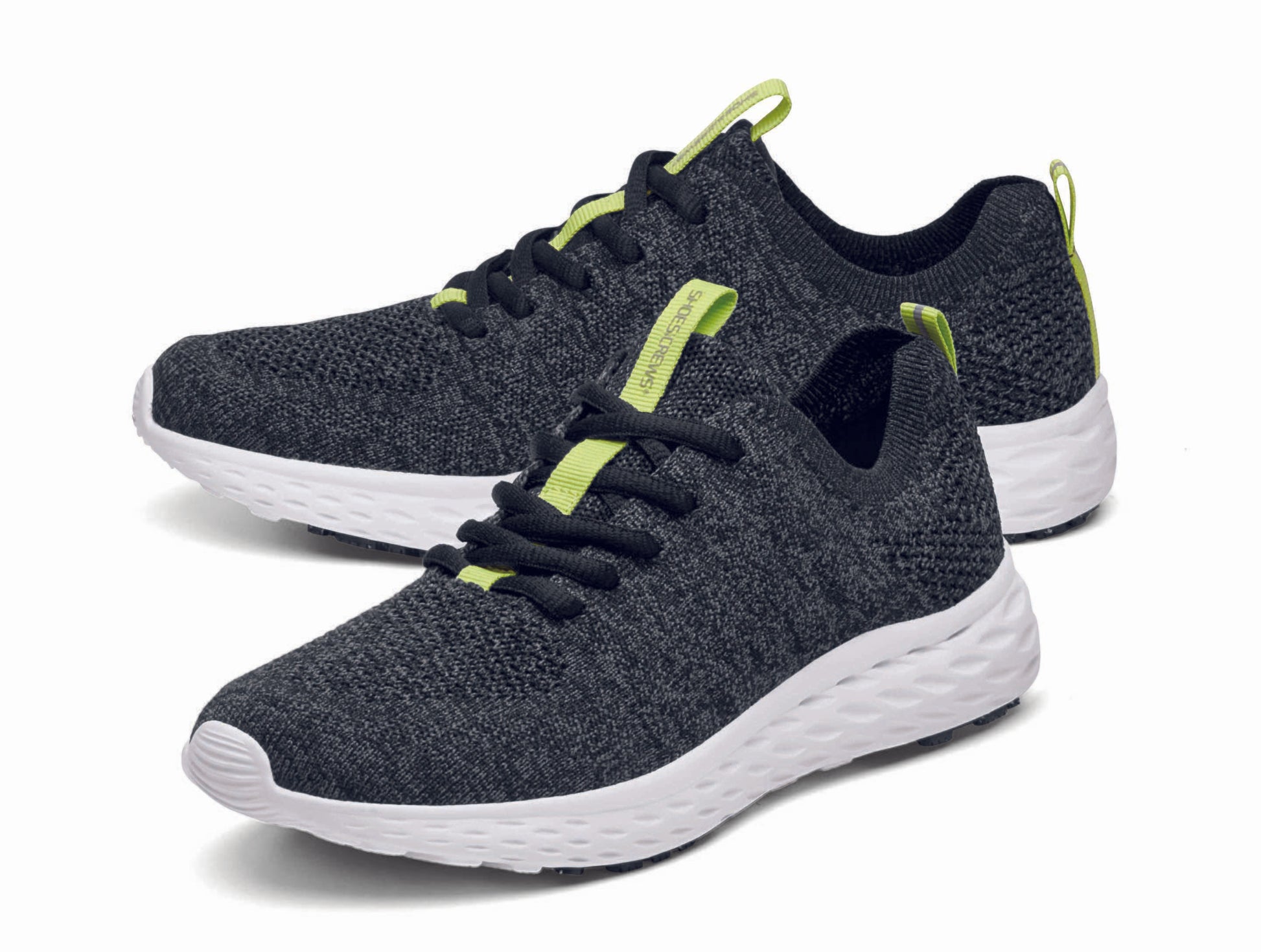 The Everlight™ ECO Womens Black/Grey from Shoes For Crews are lightweight, breathable slip-resistant trainers made from recycled materials,  pair seen from the left side, emphasised on the tip of the left  shoe.