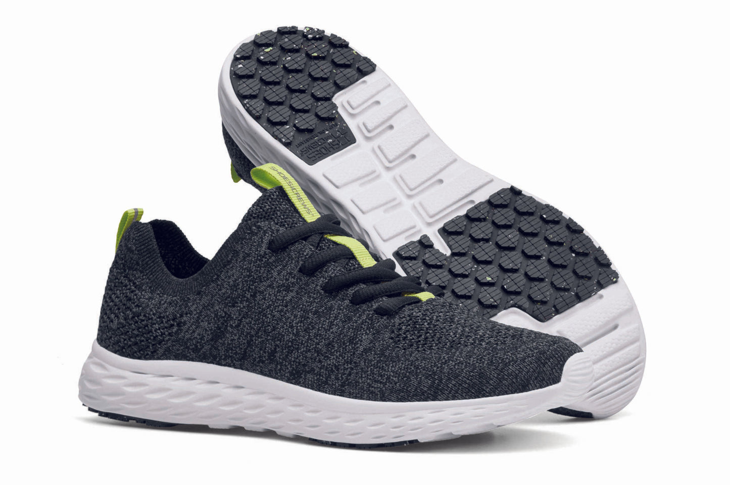 The Everlight™ ECO Womens Black/Grey from Shoes For Crews are lightweight, breathable slip-resistant trainers made from recycled materials,  pair seen from the right side and the sole.
