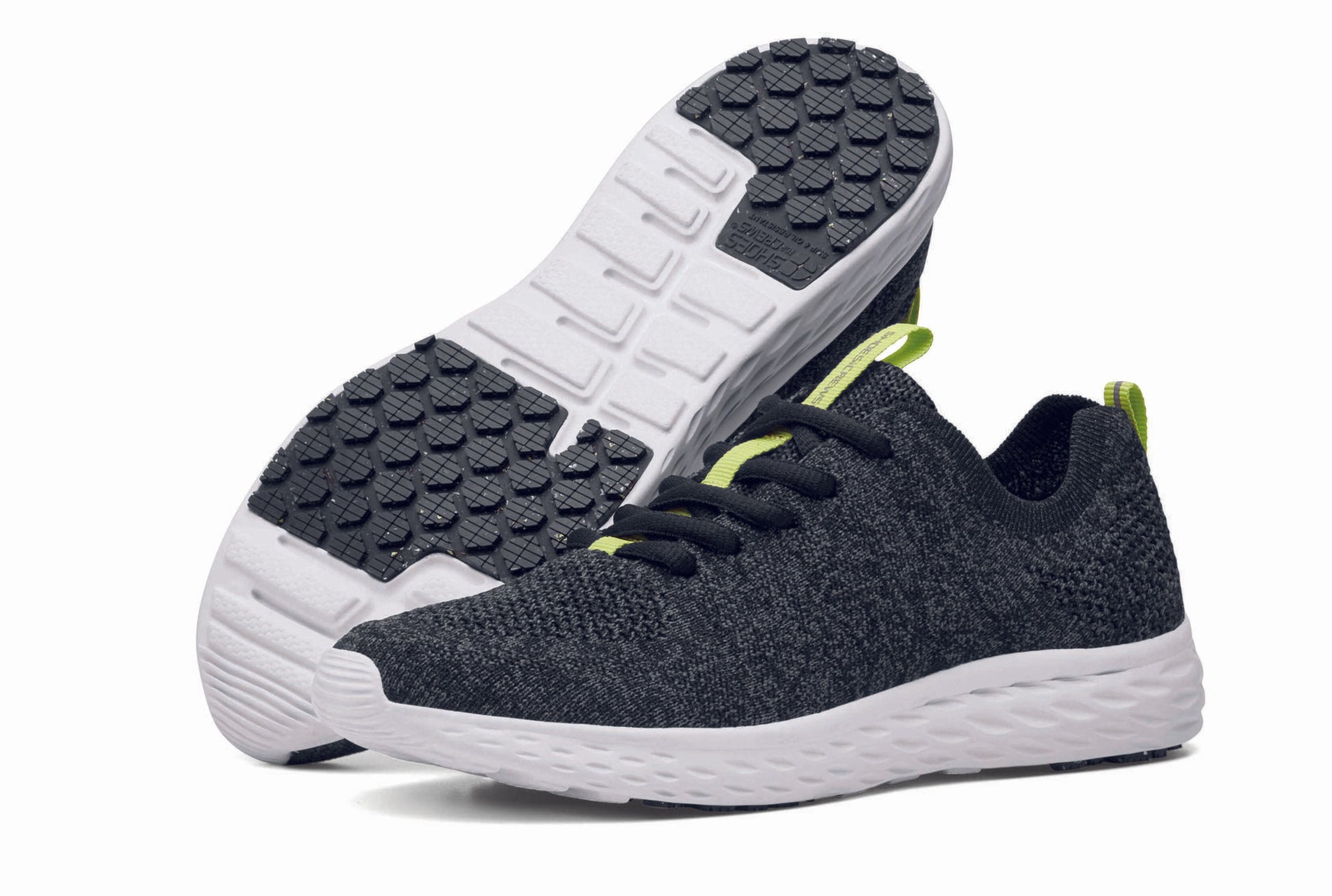 The Everlight™ ECO Womens Black/Grey from Shoes For Crews are lightweight, breathable slip-resistant trainers made from recycled materials,  pair seen from the left side and the sole.