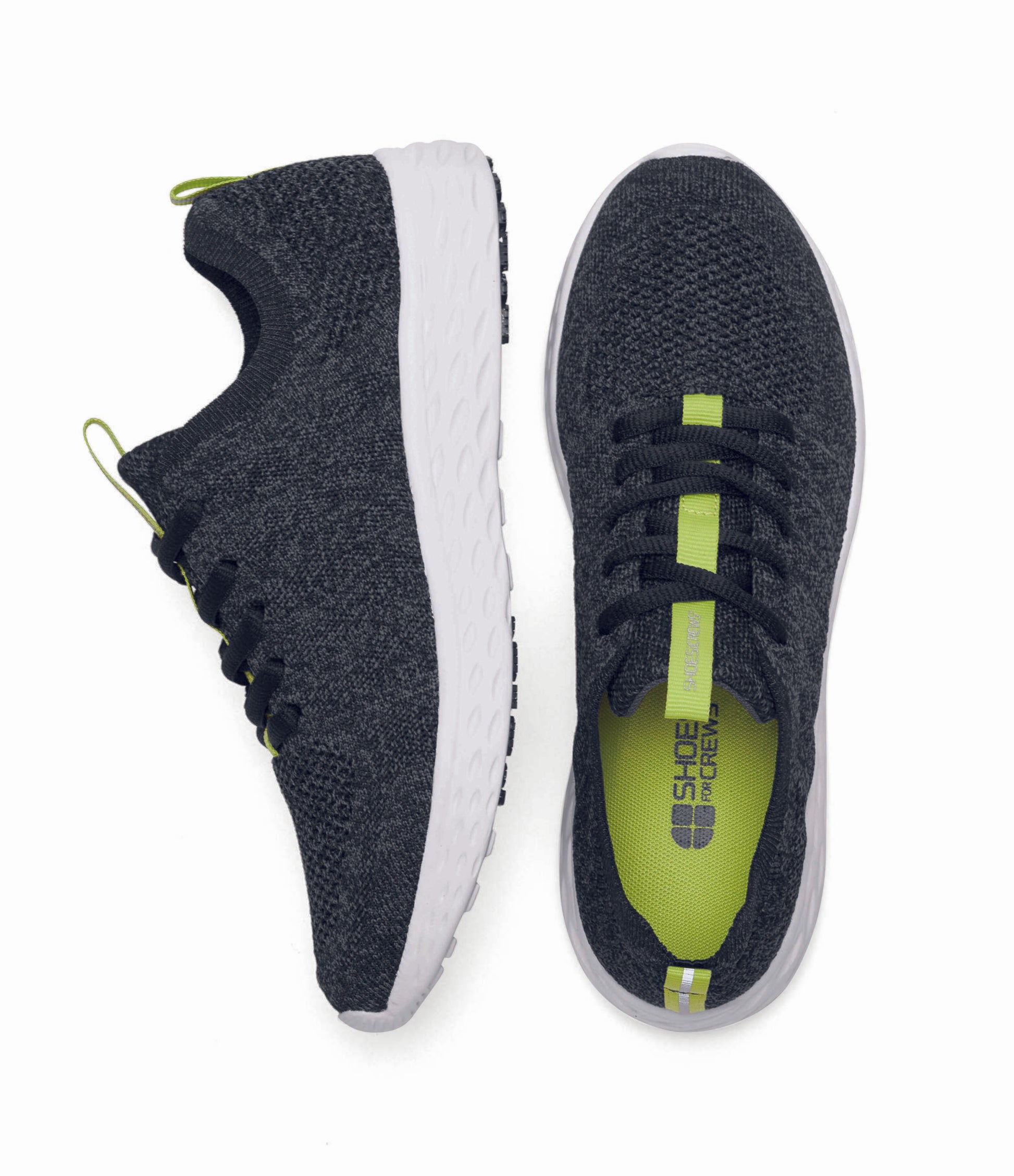 The Everlight™ ECO Womens Black/Grey from Shoes For Crews are lightweight, breathable slip-resistant trainers made from recycled materials,   viewed from the side and bottom at a vertical angle.
