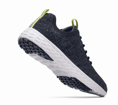 The Everlight™ ECO Womens Black/Grey from Shoes For Crews are lightweight, breathable slip-resistant trainers made from recycled materials,  seen from the perpendicular.