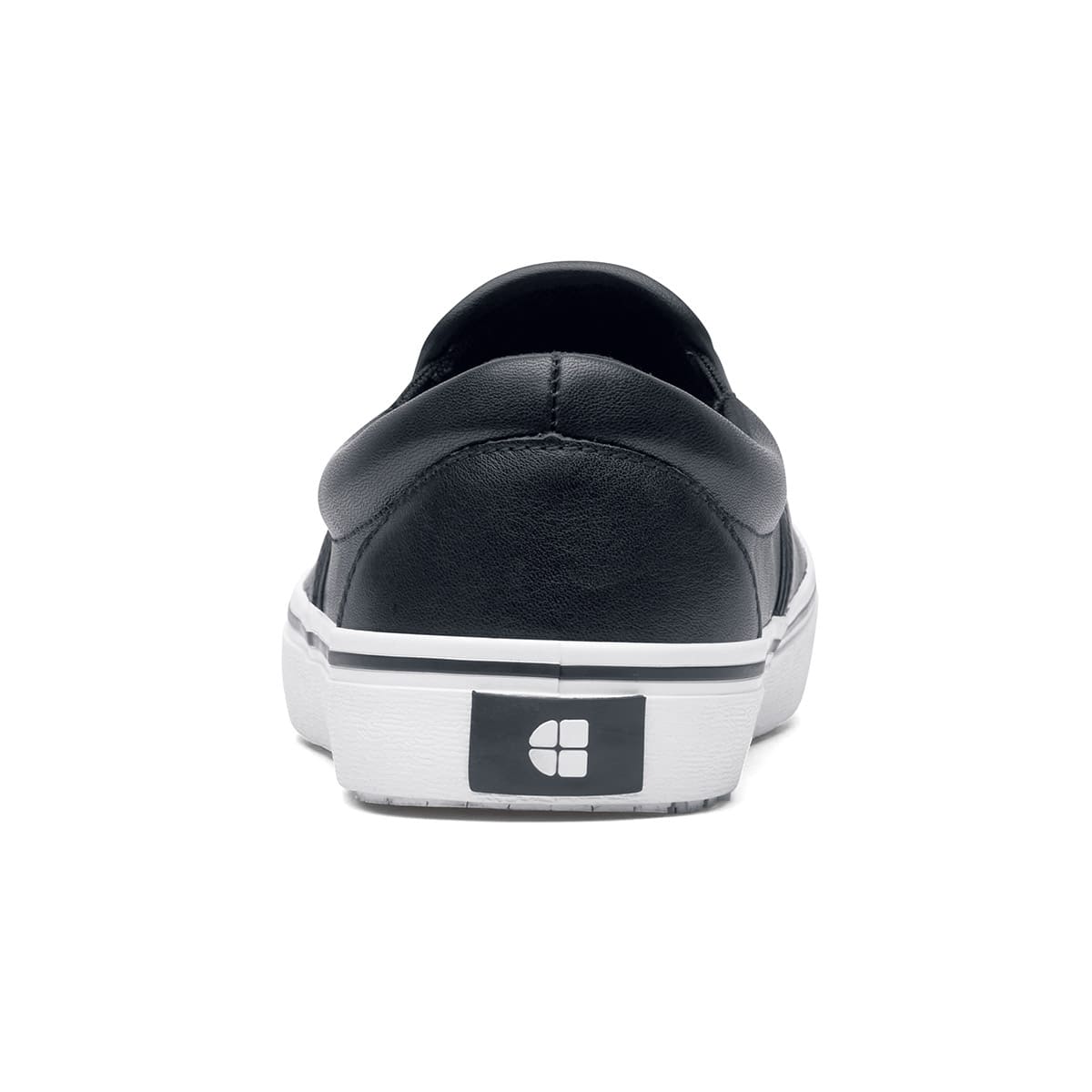 The Merlin Slip On Black and White from Shoes For Crews are slip-on trainers that are slip-resistant, lightweight, easy to clean and water-resistant, seen from the back.