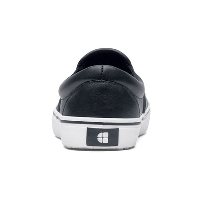 The Merlin Slip On Black and White from Shoes For Crews are slip-on trainers that are slip-resistant, lightweight, easy to clean and water-resistant, seen from the back.