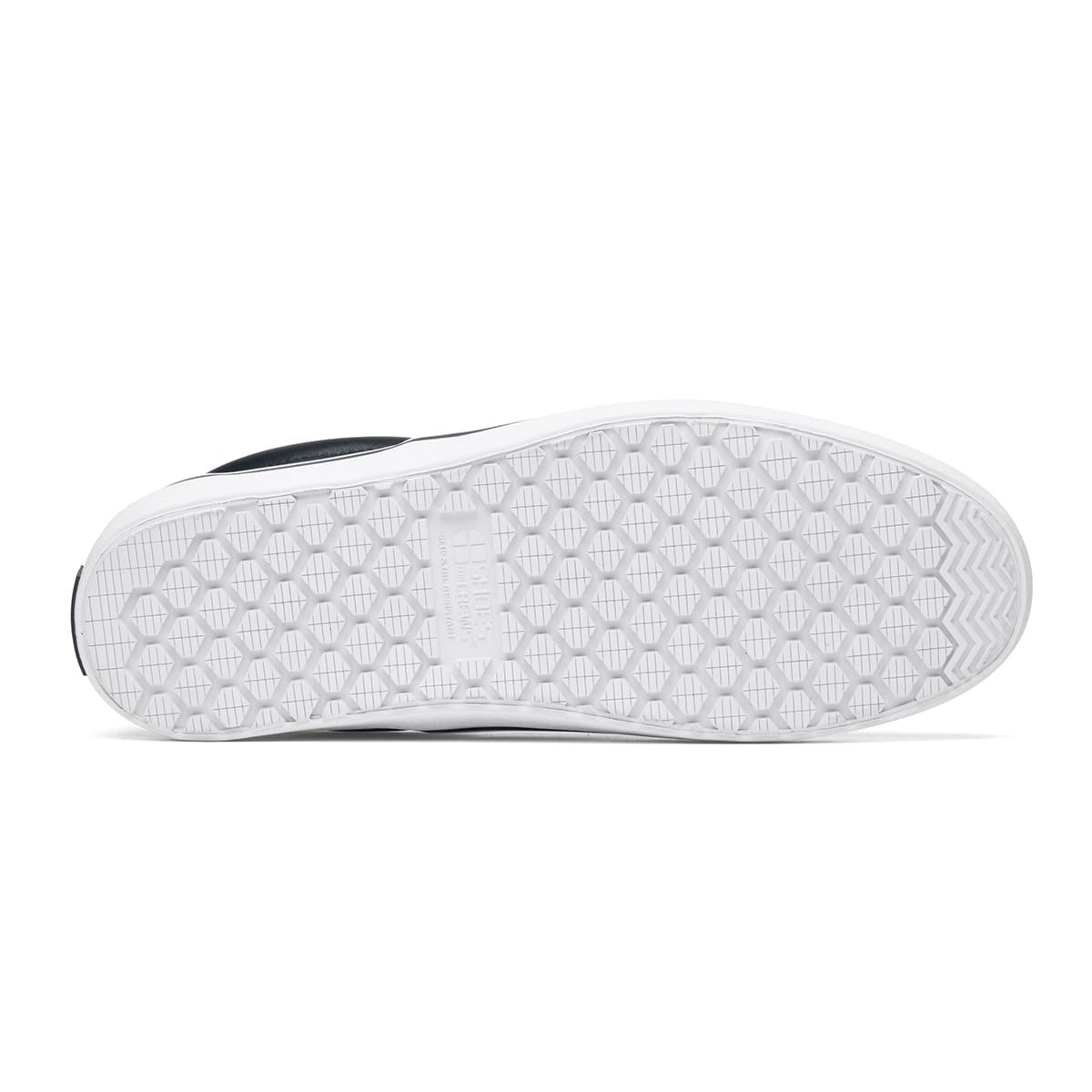 The Merlin Slip On Black and White from Shoes For Crews are slip-on trainers that are slip-resistant, lightweight, easy to clean and water-resistant, seen from below.