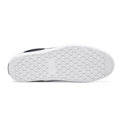 The Merlin Slip On Black and White from Shoes For Crews are slip-on trainers that are slip-resistant, lightweight, easy to clean and water-resistant, seen from below.